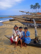 SRI LANKA, Negombo, fishing village, children posing on catamaran, SLK1558JPL