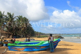 SRI LANKA, Negombo, fishing village, fisherman by his boat, SLK6070JPL