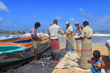 SRI LANKA, Negombo, fishing village, fishermen sorting the catch from their nets, SLK5983JPL