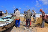 SRI LANKA, Negombo, fishing village, fishermen sorting the catch from their nets, SLK5986JPL