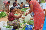 SRI LANKA, Negombo, market, fruit and vegetable market, vendor and shopper, SLK2712JPL