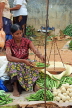 SRI LANKA, Negombo, market, fruit and vegetable market, vendor weighing Okra with scales, SK2716JPL