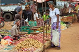 SRI LANKA, Negombo, market, fruit and vegetable market, vendor with scales, and shopper, SLK2706JPL