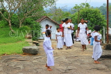 SRI LANKA, Pilimathalawa (nr Kandy), Lankatilaka Vihare, worshippers with flower offerings, SLK4133JPL