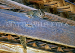 SRI LANKA, Squirrel peeping through thatched roof, SLK2121JPL