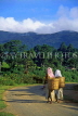 SRI LANKA, hill country, two tea pluckers walking along road, SLK320JPL