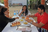 SRI LANKA, people enjoying a typical breakfast at a readside cafe, SLK4573JPL