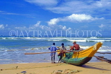 SRI LANKA, south coast, Bentota, catamaran and fishermen on beach, SLK1685JPL