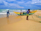 SRI LANKA, south coast, Bentota, catamaran and fishermen on beach, SLK1942JPL