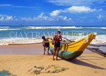 SRI LANKA, south coast, Bentota, catamaran and fishermen on beach, SLK2135JPL