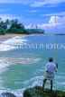 SRI LANKA, south coast, Gintota, beach, man fishing from rocks, SLK1967JPL
