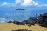 SRI LANKA, south coast, Gintota, beach, man fishing from rocks, SLK3284JPL