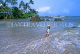 SRI LANKA, south coast, Mount Lavinia (near Mt Lavinia Hotel), child paddling, SLK182JPL