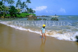 SRI LANKA, south coast, Mount Lavinia (near Mt Lavinia Hotel), child paddling, SLK2079JPL