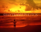 SRI LANKA, south coast, Mount Lavinia, sunset and boy on beach, SLK1584JPL