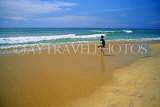SRI LANKA, south coast, Mount Lavinia, wide beach and boy walking, SLK1796JPL