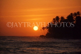 SRI LANKA, south coast, sunset over horizon (coconut trees in silhouette), SLK2027JPL