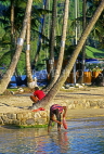 ST LUCIA, Marigot Bay, boy cleaning fish, STL737JPL