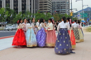 South Korea, SEOUL, Gyeongbokgung Palace, visiors in Hanbok attire outside palace, SK380JPL