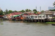 THAILAND, Bangkok, Chao Phraya River, residential houses on stilts, THA3517JPL