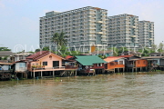 THAILAND, Bangkok, Chao Phraya River, residential houses on stilts, THA3518JPL