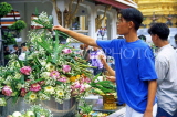 THAILAND, Bangkok, GRAND PALACE (Wat Phra Keo), worshipper and floral offerings, THA45JPL