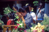 THAILAND, Bangkok, GRAND PALACE (Wat Phra Keo), worshipper with flower and incense offerings, THA993JPL