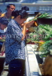 THAILAND, Bangkok, GRAND PALACE (Wat Phra Keo), worshipper with flower and incense offerings, THA994JPL