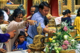 THAILAND, Bangkok, GRAND PALACE, worshippers bathing Buddha image, Songkran (New Year), THA06JPL