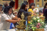 THAILAND, Bangkok, GRAND PALACE, worshippers bathing Buddha image, Songkran (New Year), THA1908JPL