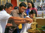 THAILAND, Bangkok, GRAND PALACE, worshippers bathing Buddha image, Songkran (New Year), THA729JPL
