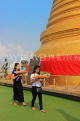 THAILAND, Bangkok, WAT SAKET (Golden Mount Temple), visitors carrying offerings, THA3320JPL