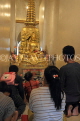 THAILAND, Bangkok, WAT SAKET (Golden Mount Temple), worshippers in shrine, THA3326JPL