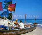 THAILAND, Hua-Hin, beach scene with fishermen sorting out nets on boat, THA1754JPL