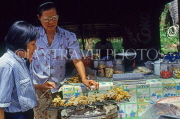 THAILAND, Ko Samui Island, market stall selling grilled cuttlefish on skewers, THA1976JPL