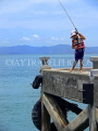 THAILAND, Koh Phangan Island, boy fishing off pier, THA2092JPL