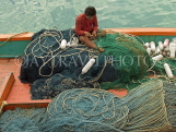 THAILAND, Koh Phangan Island, fisherman mending his nets, THA2212JPL