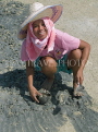 THAILAND, Koh Phangan Island, worker digging for cockles, posing, THA2021JPL