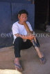 THAILAND, Northern Thailand, Chiang Rai, hill tribes, Lisu man smoking large pipe, THA1906JPL