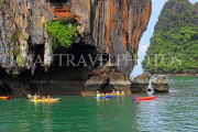 THAILAND, Phang Nga Bay, Panak Island, tourists exploring by sea canoe, THA4273JPL