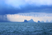 THAILAND, Phang Nga Bay, limestone islands, islet rock formations, clouds, rain, THA4256JPL