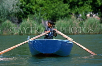 TURKEY, Dalyan Delta, boy rowing small boat, TUR694JPL