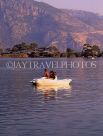TURKEY, Fethiye area, Olu Deniz lagoon, holidaymakers in paddleboat, TUR356JPL