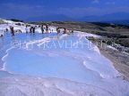 TURKEY, Pamukkale, chalkstone terraces and visitors at thermal springs, TUR258JPL