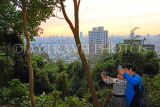 Taiwan, TAIPEI, Elephant Mountain, city view and couple taking selfies, TAW452JPL