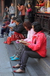 Taiwan, TAIPEI, Lungshan Temple, people reading Buddhist scriptures, TAW704JPL