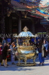 Taiwan, TAIPEI, Lungshan Temple, worshippers by incense burner censer, TAW666JPL