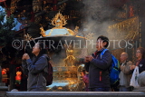 Taiwan, TAIPEI, Lungshan Temple, worshippers by incense burner censer, night view, TAW630JPL