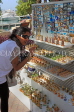 UAE, DUBAI, tourist browisng at souvenir stall, UAE665JPL