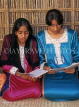 UAE, DUBAI, two women reading the Koran, DUB220JPL
